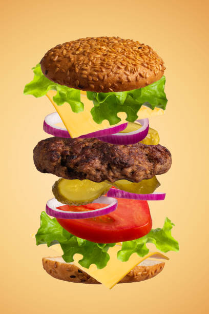 istock Hamburger, cheeseburger. Cutlet, lettuce, tomatoes, pickled cucumbers, cheese, onions and a bun. 1426142413