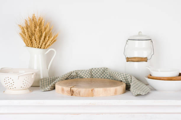 istock Wooden stand on kitchen table with decoration and copy space 1426144141