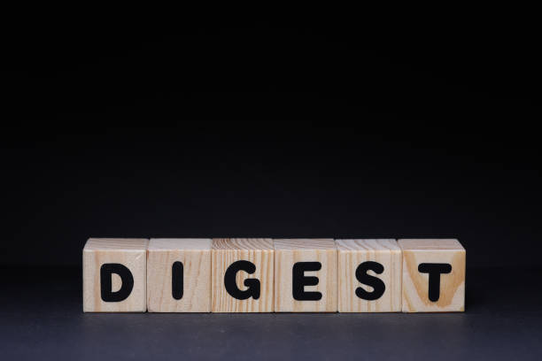 istock Digest word on wooden cubes on black background 1426144794