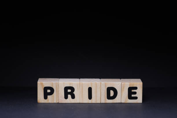 istock Pride word on wooden cubes on black background 1426144800