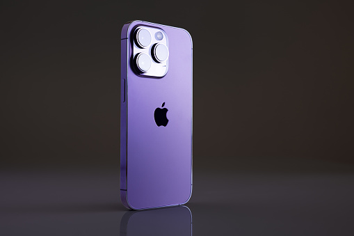 Madrid, Spain - September 21, 2022: Newly released iPhone 14 Pro in Deep Purple color on dark background