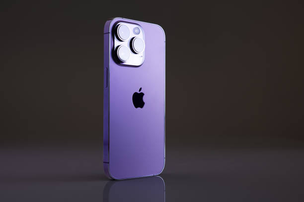 iPhone 14 Pro on dark background stock photo