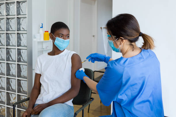istock Woman being vaccinated during pandemic 1426147023