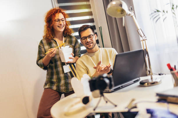 istock Couple working at home eating chinese food ordered online. 1426155302