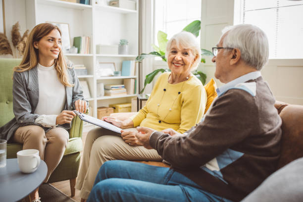 istock Senior couple consulting with female advisor 1426155617