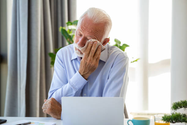 istock Crying senior man. Negative emotion facial expression feeling. Modern office man at working place, depression and crisis concept 1426157518