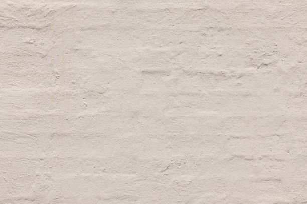 Close-up on an old painted brick wall.