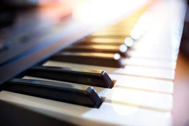 Photo of Piano keyboard background on stage playing live music at gig