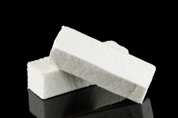 Pastilla white confectionery product on black.