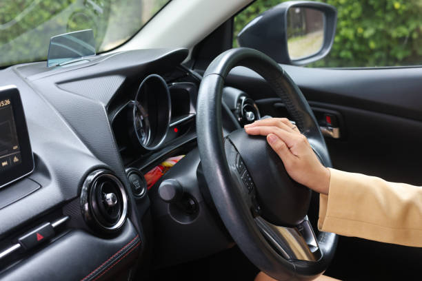 istock Woman pressing the horn while driving a car through the road. 1426162731