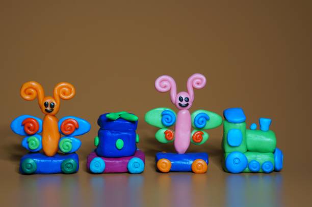 istock Christmas train with toy butterflies and a gift. 1426164410