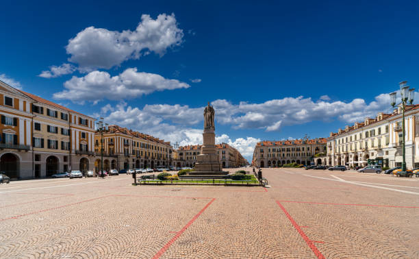 Galimberti Square in Cuneo, Italy Cuneo, Piedmont, Italy - August 06, 2022: View on Tancredi Duccio Galimberti Square with Statue of Giuseppe Barbaroux, in the background the beginning of corso Nizza cuneo stock pictures, royalty-free photos & images