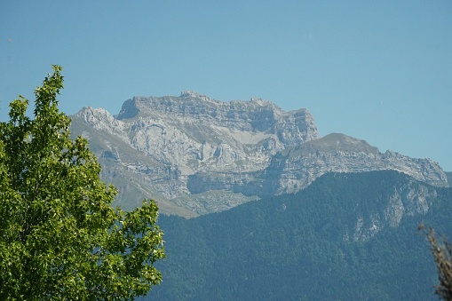 Sevrier, France - 16 August 2022: Looking towards one of the many rocky escarpments that overlook Lake Annecy.