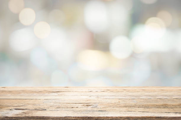 istock Empty wooden table for present product on bokeh blur background image. 1426170436