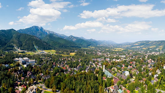 Aerial view of modern Epagny Gruyeres town and rural surroundings in La Gruyere Fribourg Switzerland