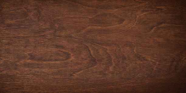 istock brown boards as a template for design. dark wood texture backdrop 1426177573