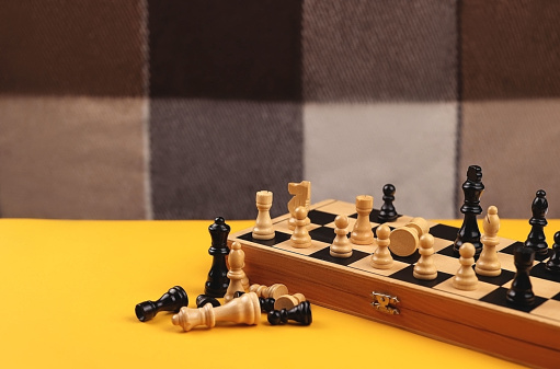 chess on the board with yellow background. High quality photo