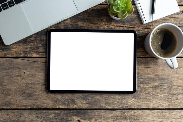 istock Mockup image tablet with blank white screen on wooden table 1426179454