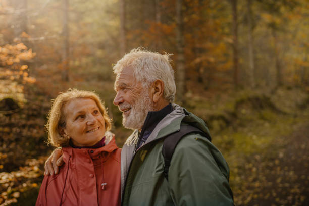 istock Portrait of a senior couple while walking through the forest 1426180744