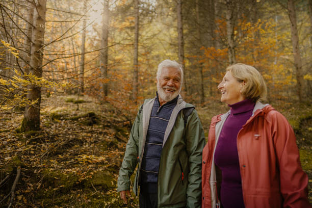 istock Portrait of a senior couple while walking through the forest 1426180746