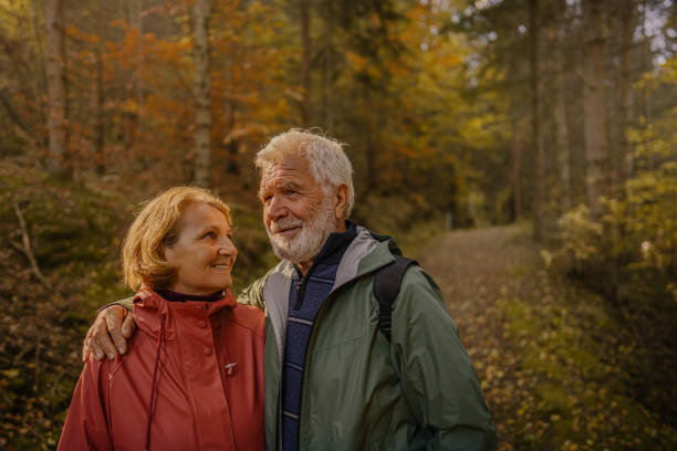istock Portrait of a senior couple while walking through the forest 1426180747