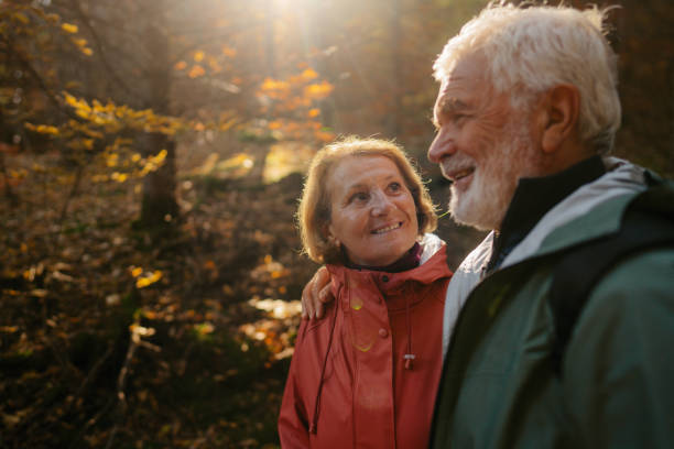 istock Portrait of a senior couple while walking through the forest 1426180765