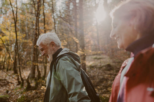 istock Portrait of a senior couple while walking through the forest 1426180786