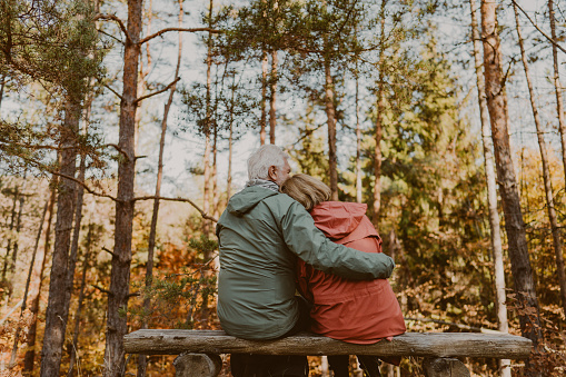 Photo of a senior couple enjoying a beautiful day in the forest