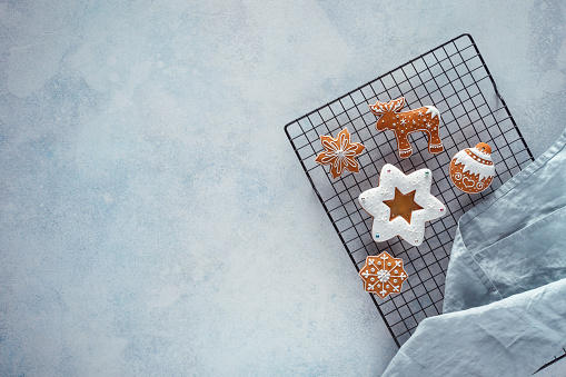 Fresh baked Christmas cookies in Christmas style. Shortbread cookies in the shape of stars. View with copy space