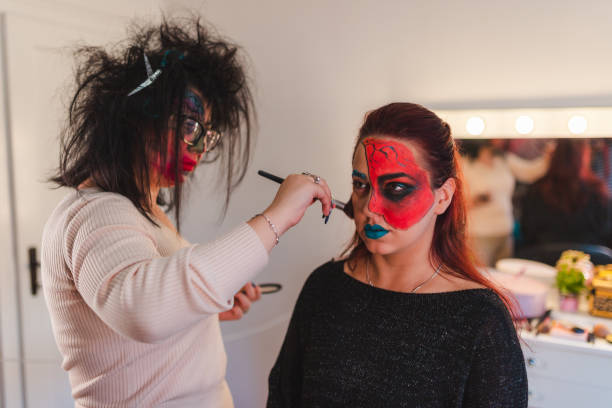 istock Two young women getting ready for Halloween by getting their makeup done 1426181546