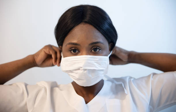 An isolated shot of an african american nurse wearing a surgical mask