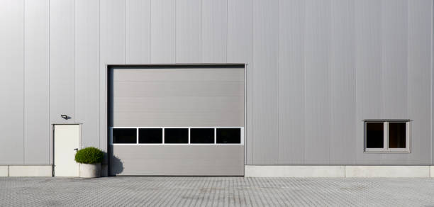 istock Silver rolling garage door and storehouse facade 1426189201