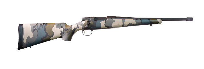 Bolt action centerfire rifle with a camouflage stock isolated on white