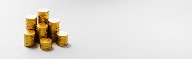 istock Heaps of Coins on Light Gray Background with Copy Space 1426193334