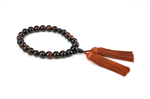 istock A small bead is pierced with a thread and there are two tassel beads 1426193961