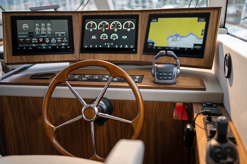 Close-up of steering wheel of luxury yacht.