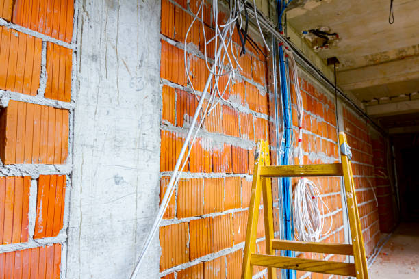 istock View on ladder and cable tray with bundle of cables between floors in building 1426201369