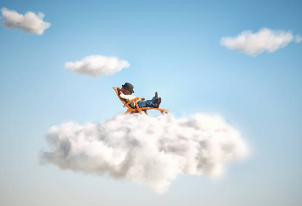istock Man relaxing on a cloud. Contemplation and aspirations concept. 1426204364