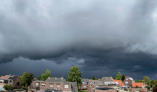 Thunderclouds are coming near over the city