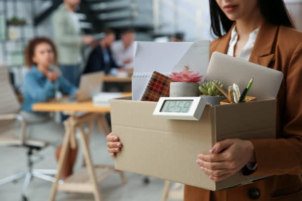 istock Young dismissed woman carrying box with stuff in office, closeup. Space for text 1426212919
