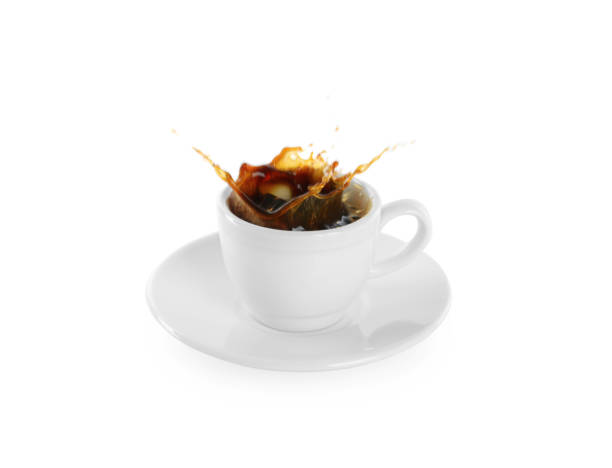 istock Coffee splashing out of cup on white background 1426214102