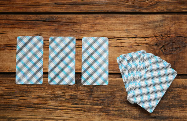 Tarot cards on wooden table, flat lay. Reverse side