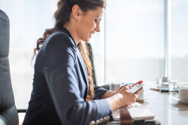 istock Young Businesswoman Using Smartphone In The Office 1426220873