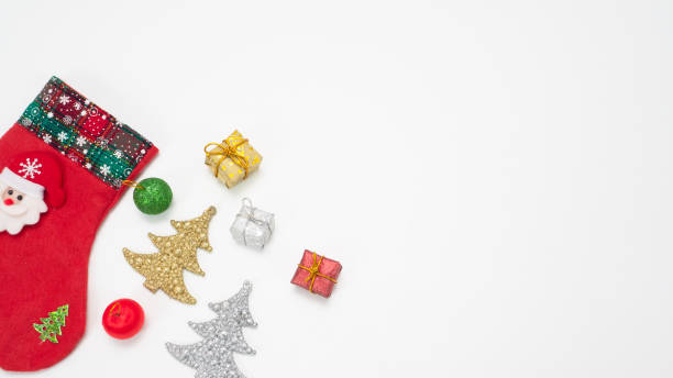 istock Christmas stocking with object ornament new year concept top view copy space white isolated 1426222317