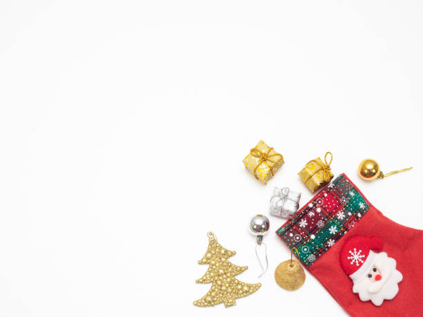 istock Christmas gift and accessories and stocking on white isolated copy space top view 1426222819