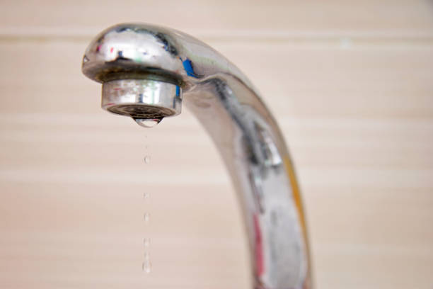 istock Drops of water falling down from the crane 1426223338