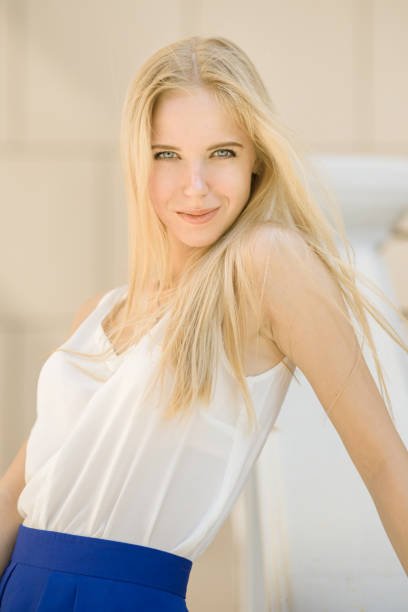 beautiful blond woman looking at camera outdoor
