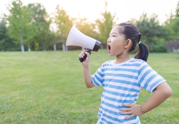 istock Little Girl Speaking by Megaphone 1426226371