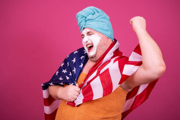 istock Funny fat man is washing himself in the shower. 1426229936