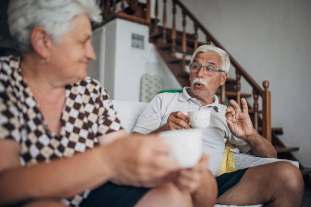 istock Senior married couple drinking coffee at home 1426230159